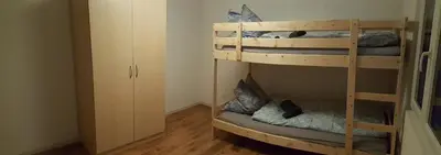 Ein Bett oder Betten in einem Zimmer der Unterkunft Attika Wohnung Spiez