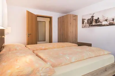 Ein Bett oder Betten in einem Zimmer der Unterkunft Ferienhaus Matterhorngruss