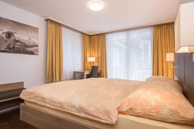 Ein Bett oder Betten in einem Zimmer der Unterkunft Ferienhaus Matterhorngruss