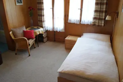 Ein Bett oder Betten in einem Zimmer der Unterkunft Hotel Alpina