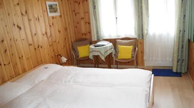 Ein Bett oder Betten in einem Zimmer der Unterkunft Hotel Alpina