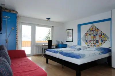 Ein Bett oder Betten in einem Zimmer der Unterkunft Artist Apartments & Hotel Garni