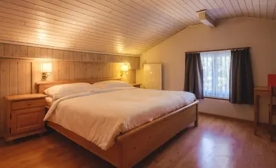 Ein Bett oder Betten in einem Zimmer der Unterkunft Guesthouse by the rex
