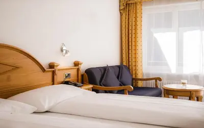 Ein Bett oder Betten in einem Zimmer der Unterkunft Walliserhof