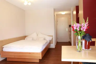 Ein Bett oder Betten in einem Zimmer der Unterkunft Eiger Guest House - Grindelwald