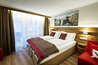 Ein Bett oder Betten in einem Zimmer der Unterkunft Apartments Butterfly Zermatt