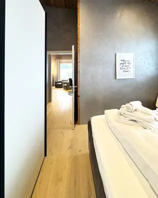 Ein Bett oder Betten in einem Zimmer der Unterkunft WOO® Loft Resort
