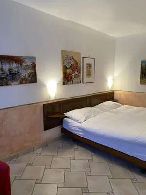 Ein Bett oder Betten in einem Zimmer der Unterkunft Hotel Antico