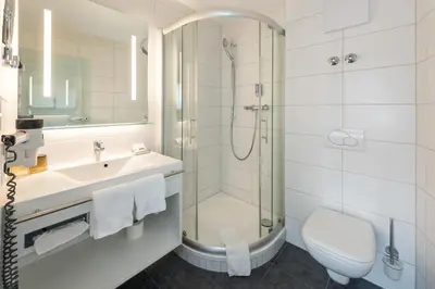 Ein Badezimmer in der Unterkunft Hotel Rhodania