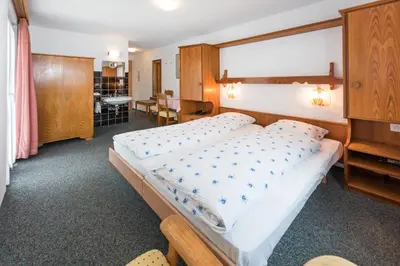 Ein Bett oder Betten in einem Zimmer der Unterkunft Hotel Rhodania