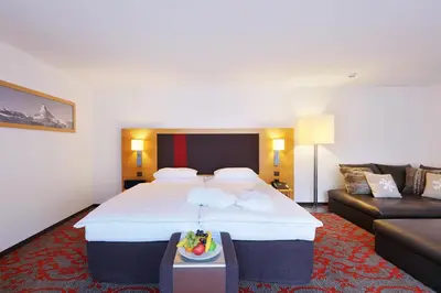 Ein Bett oder Betten in einem Zimmer der Unterkunft Hotel Garni Testa Grigia