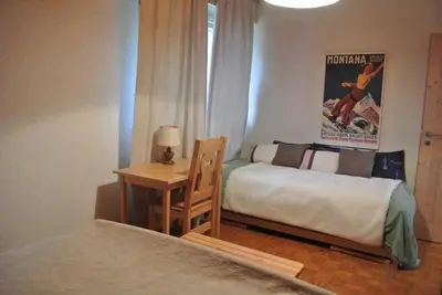 Ein Bett oder Betten in einem Zimmer der Unterkunft Crans Montana Cervin 35