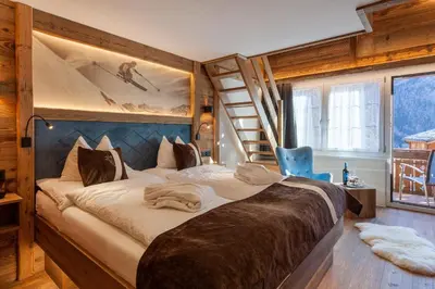 Ein Bett oder Betten in einem Zimmer der Unterkunft Silvana Mountain Hotel