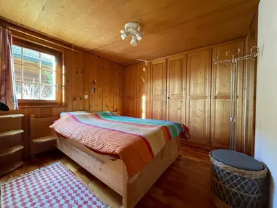 Ein Bett oder Betten in einem Zimmer der Unterkunft Alpenparadies