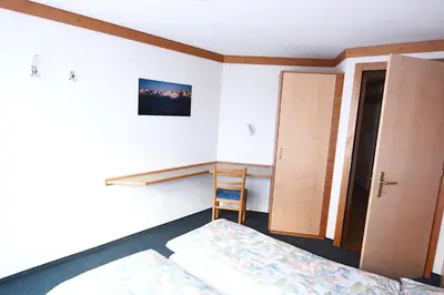 Ein Bett oder Betten in einem Zimmer der Unterkunft Bergfreude