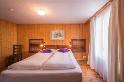 Ein Bett oder Betten in einem Zimmer der Unterkunft Hotel Tell and Apartments