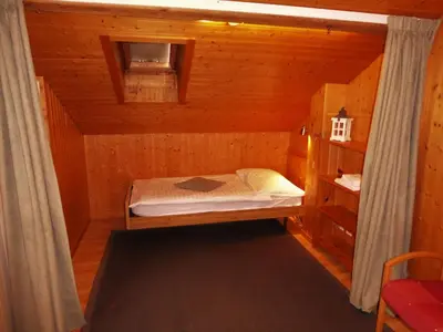 Ein Bett oder Betten in einem Zimmer der Unterkunft Hotel Tell and Apartments