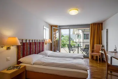 Ein Bett oder Betten in einem Zimmer der Unterkunft Schönbühl Hotel & Restaurant Lake Thun