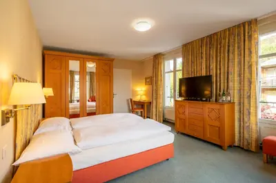 Ein Bett oder Betten in einem Zimmer der Unterkunft Schönbühl Hotel & Restaurant Lake Thun