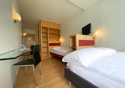 Ein Bett oder Betten in einem Zimmer der Unterkunft Hotel Seaside