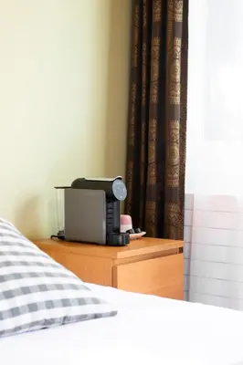 Ein Bett oder Betten in einem Zimmer der Unterkunft Motel-Restaurant 13 Etoiles
