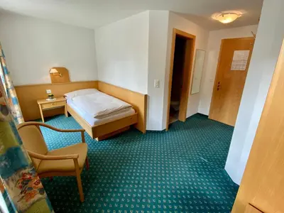Ein Bett oder Betten in einem Zimmer der Unterkunft Hotel Portjengrat