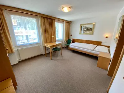 Ein Bett oder Betten in einem Zimmer der Unterkunft Hotel Portjengrat