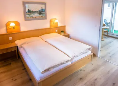 Ein Bett oder Betten in einem Zimmer der Unterkunft Hotel Portjengrat