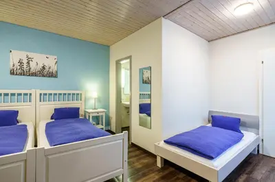 Ein Bett oder Betten in einem Zimmer der Unterkunft Hotel Alphorn