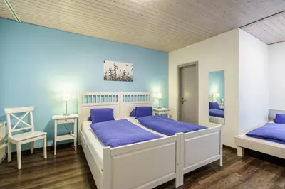 Ein Bett oder Betten in einem Zimmer der Unterkunft Hotel Alphorn