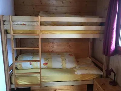 Ein Bett oder Betten in einem Zimmer der Unterkunft Chalet Marina