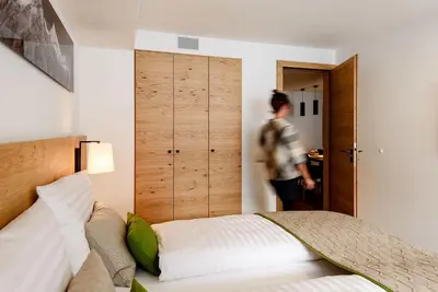 Ein Bett oder Betten in einem Zimmer der Unterkunft EVA Apartments