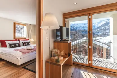 Ein Bett oder Betten in einem Zimmer der Unterkunft Sonnmatten Boutique Hotel & Apartments Zermatt