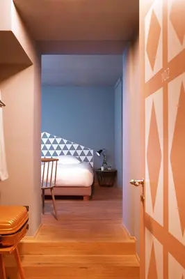 Ein Bett oder Betten in einem Zimmer der Unterkunft Hotel De Londres