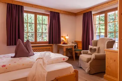 Ein Bett oder Betten in einem Zimmer der Unterkunft Hotel Berghof