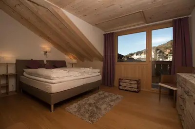 Ein Bett oder Betten in einem Zimmer der Unterkunft Chalet Belmont Penthouse