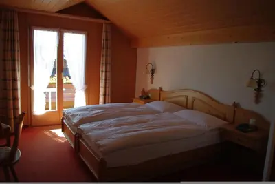 Ein Bett oder Betten in einem Zimmer der Unterkunft Hotel Adler