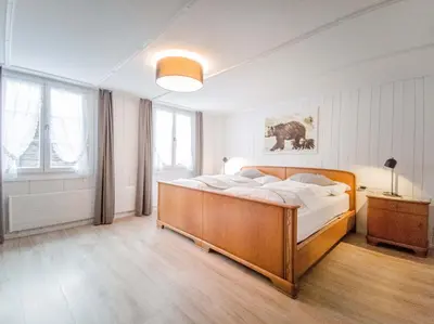 Ein Bett oder Betten in einem Zimmer der Unterkunft Hotel Bären Guttannen