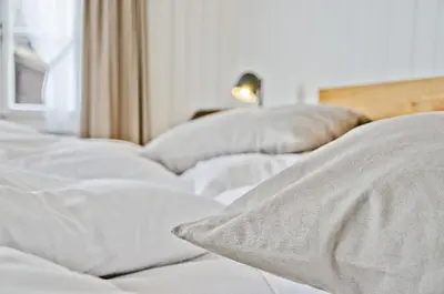 Ein Bett oder Betten in einem Zimmer der Unterkunft Hotel Bären Guttannen