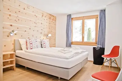 Ein Bett oder Betten in einem Zimmer der Unterkunft Apartment Matterhorn - GRIWA RENT AG