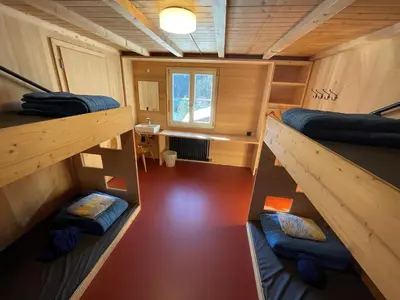 Ein Bett oder Betten in einem Zimmer der Unterkunft Naturfreunde Hostel Grindelwald