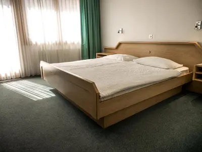 Ein Bett oder Betten in einem Zimmer der Unterkunft Hotel Olympica