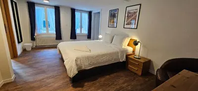 Ein Bett oder Betten in einem Zimmer der Unterkunft The Aarburg Hotel & Café