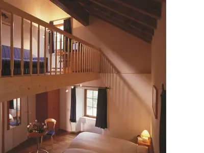 Ein Bett oder Betten in einem Zimmer der Unterkunft Hotel du Pigne