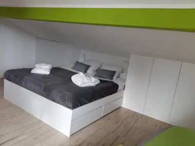 Ein Bett oder Betten in einem Zimmer der Unterkunft Le Manoir de Champlan