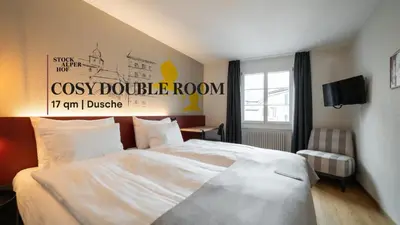 Ein Bett oder Betten in einem Zimmer der Unterkunft Hotel Stockalperhof