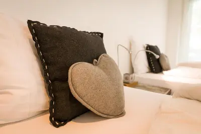 Ein Bett oder Betten in einem Zimmer der Unterkunft Casa Della Vita by Zermatt Premium Apartments