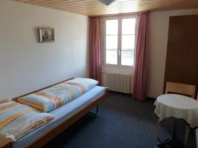 Ein Bett oder Betten in einem Zimmer der Unterkunft Berghaus Männlichen