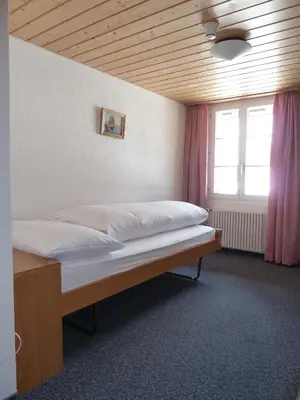 Ein Bett oder Betten in einem Zimmer der Unterkunft Berghaus Männlichen
