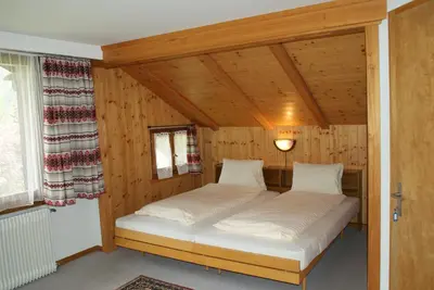 Ein Bett oder Betten in einem Zimmer der Unterkunft Hotel Pension Spycher